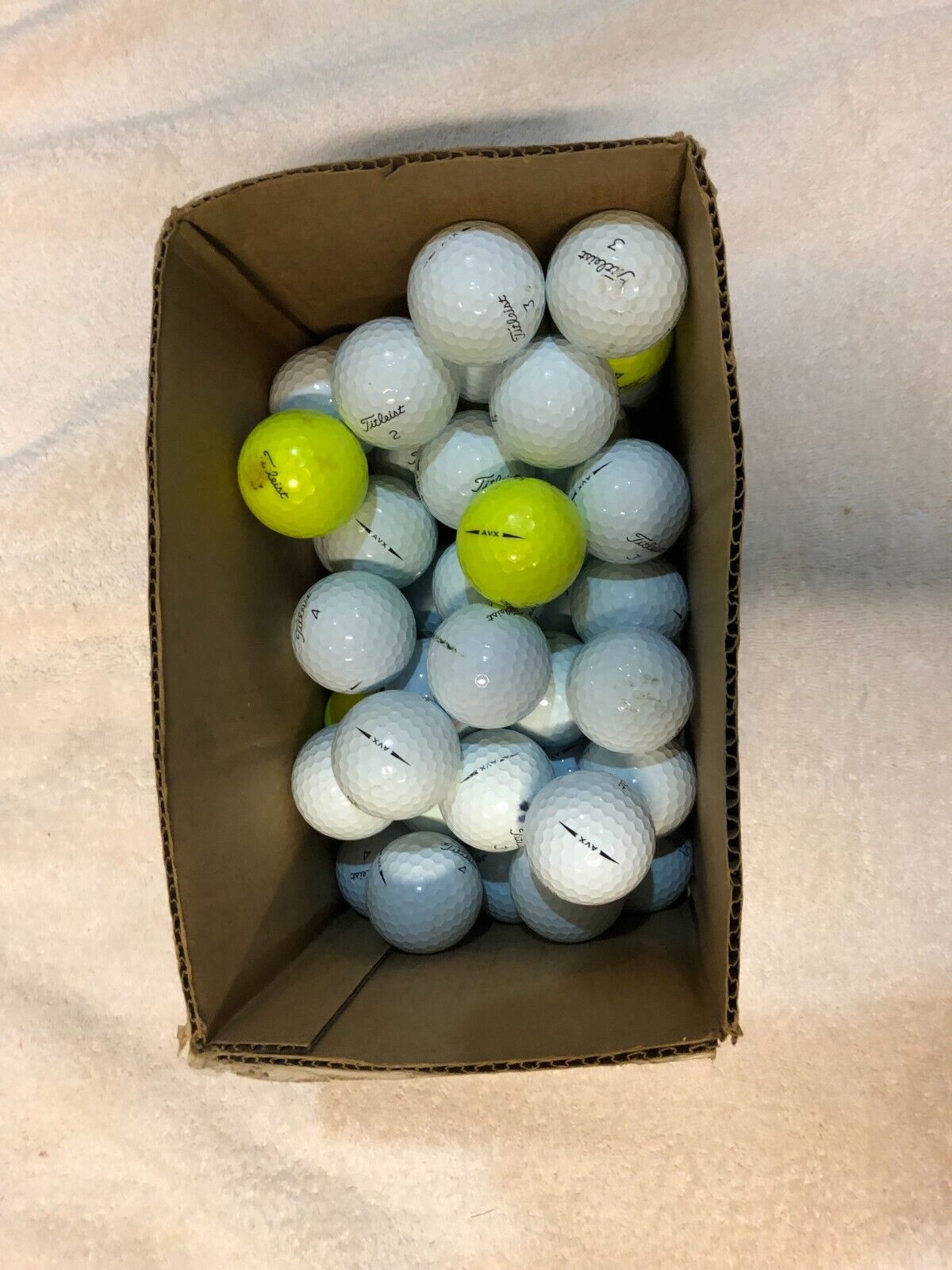 55 Titleist AVX  AA + golf balls