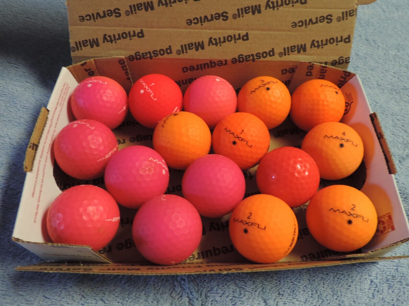 DE 15 MAXFLI Softfli and straight fli Red and Orange golf balls