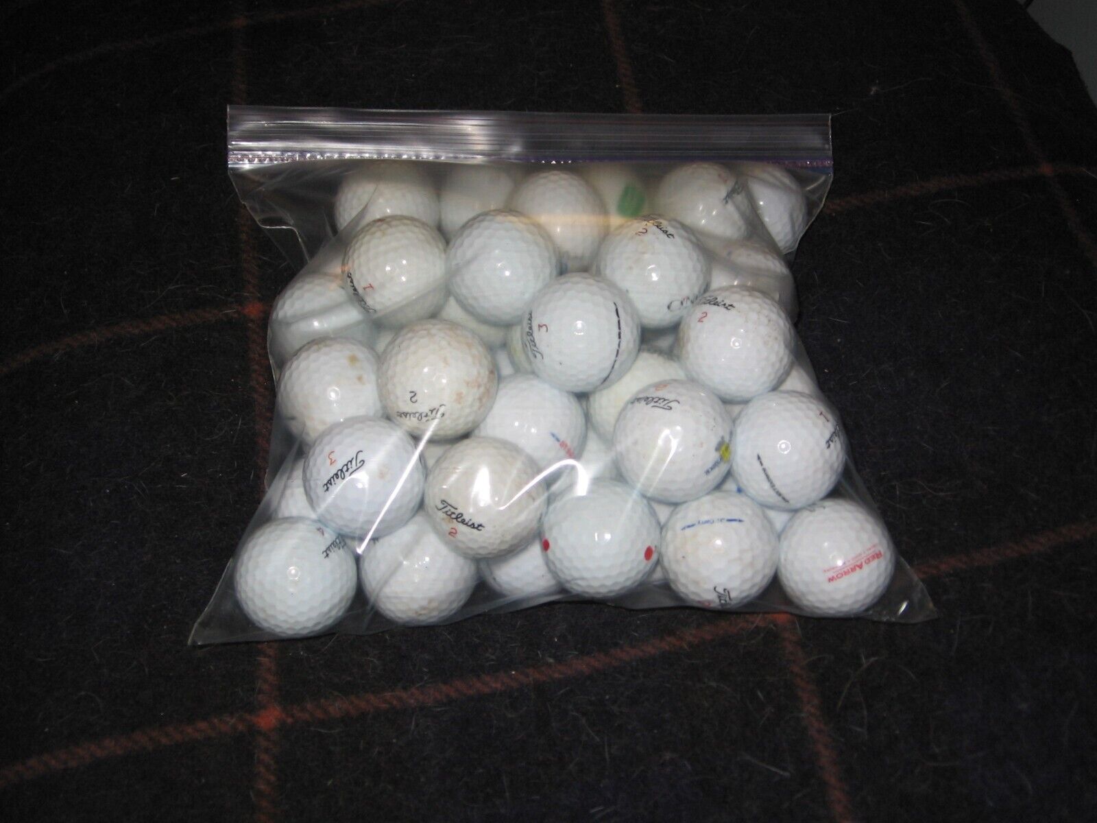25 used Titleist balls. Great condition. Include 5 extra PROV1 with \